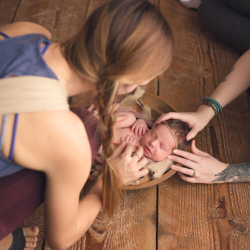 Portland Oregon Newborn Photographer, Erin Tole Adjusting baby during newborn workshop