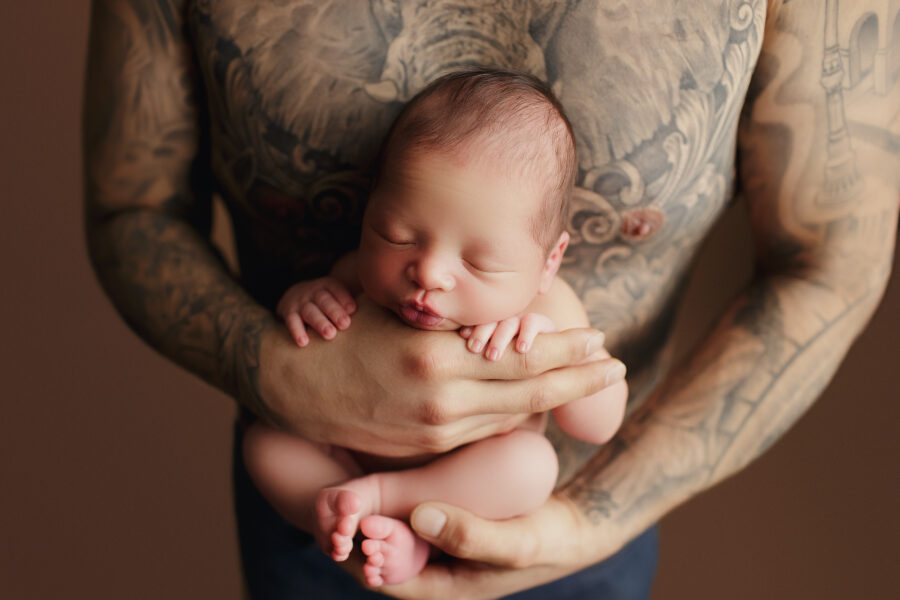 Newborn Photography Workshops, father holding newborn baby